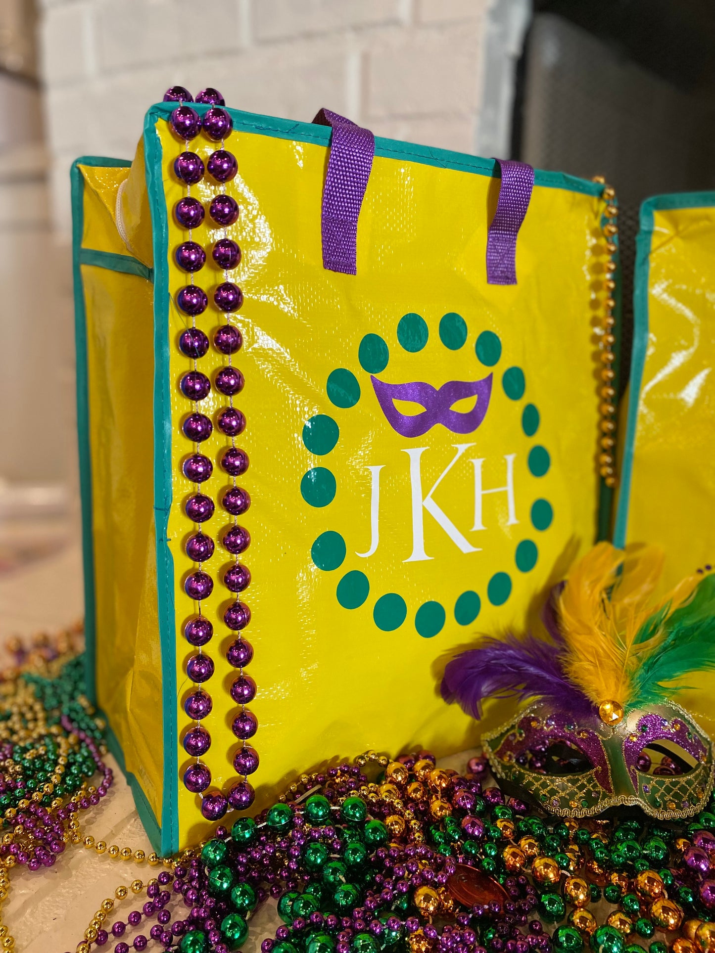 A Mardi Gras Beads and Loot Bag, Reusable, zipper and handles throws bag